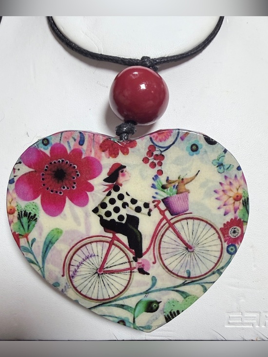 SYLCA Jewelry - SYLCA RESIN HEART GIRL ON ON BICYCLE LEATHER ADJUSTABLE NECKLACE